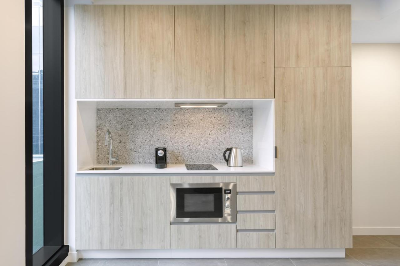 Meriton Suites Melbourne Exterior foto A kitchen in a serviced apartment