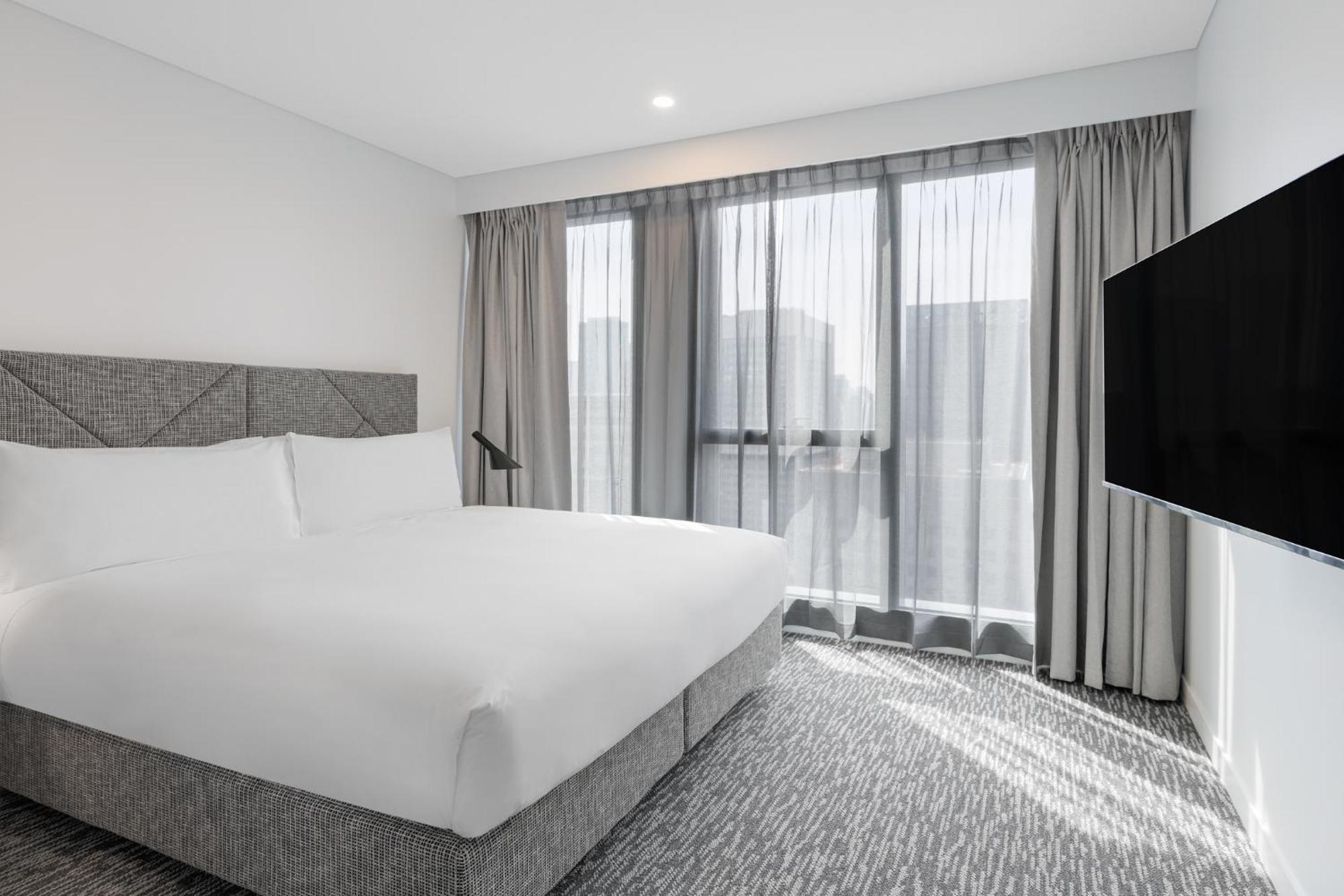 Meriton Suites Melbourne Exterior foto A bedroom at the hotel