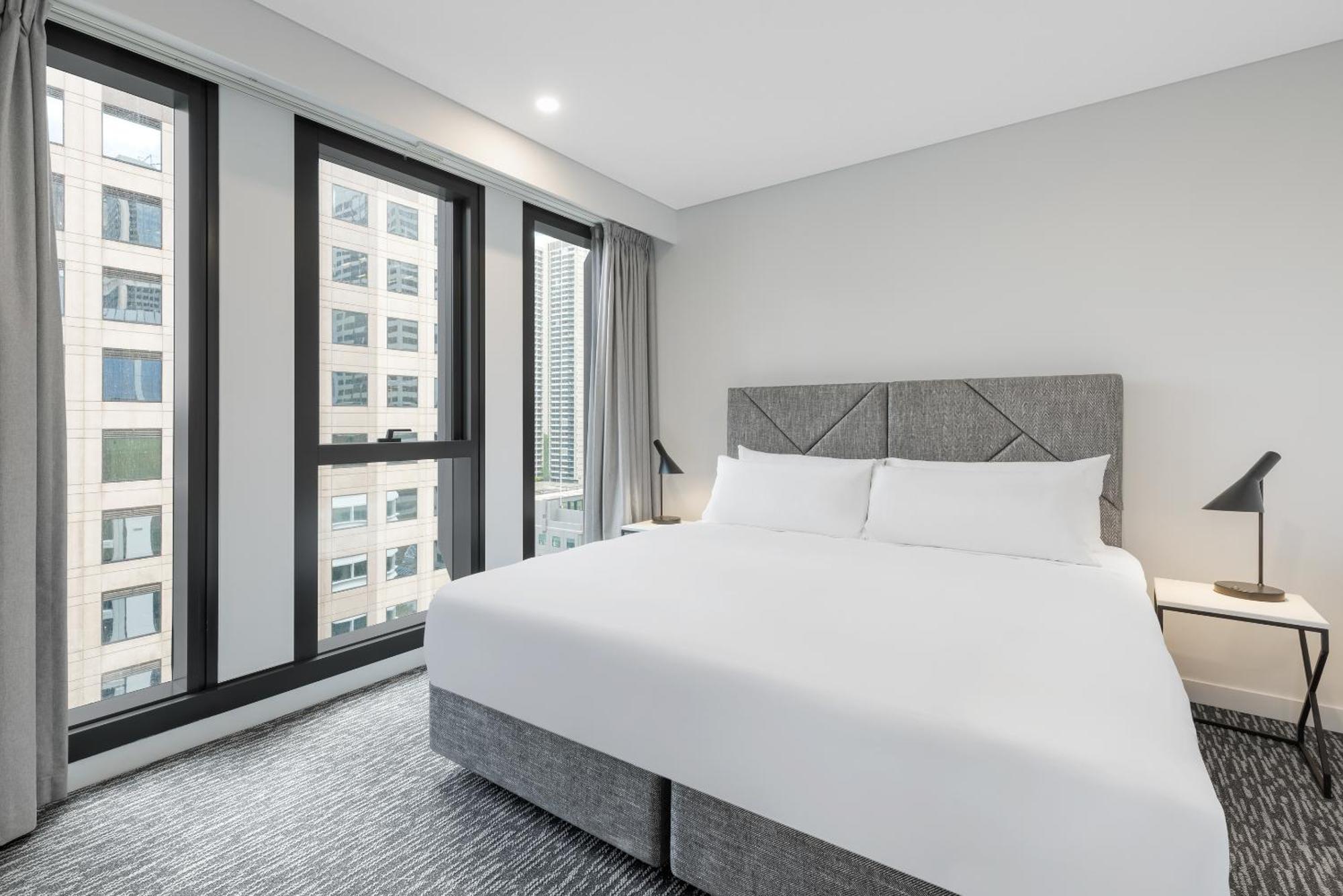 Meriton Suites Melbourne Exterior foto A bedroom at the hotel