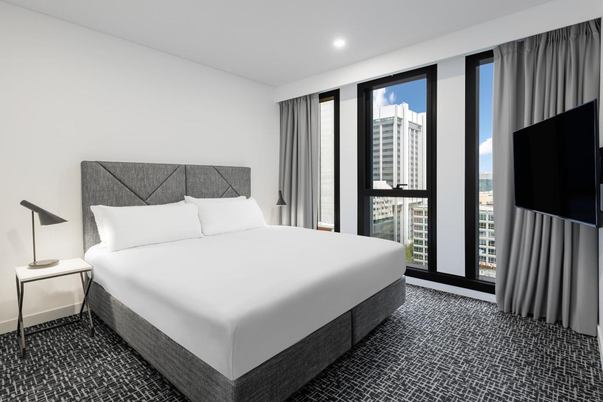 Meriton Suites Melbourne Exterior foto A bedroom at the hotel